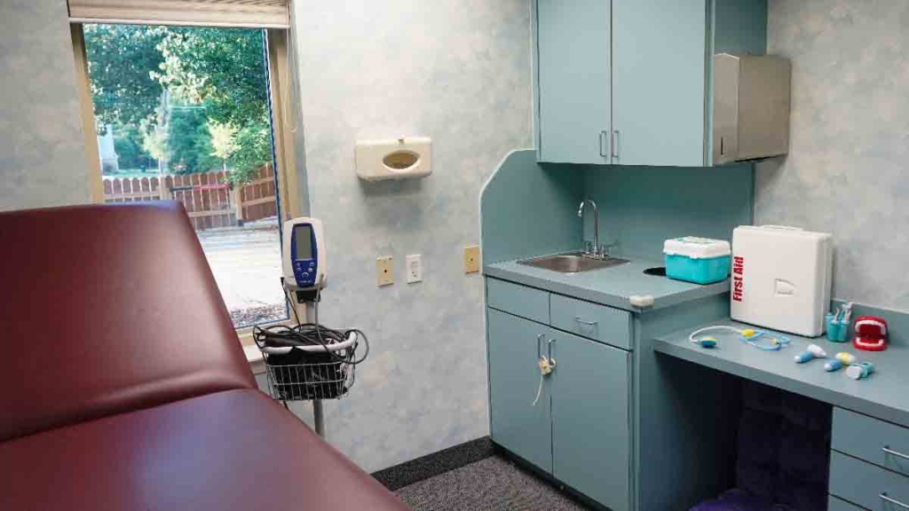A mock doctors office exam room with pretend doctors equipment at Bright Mosaic