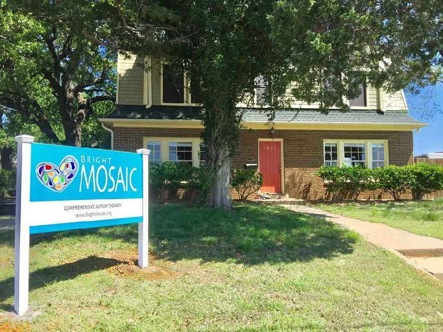 Exterior of Bright Mosaic Autism Center on N. Locust St. in Denton, showing the front office and signage for ABA Therapy, Speech Therapy, and OT services.